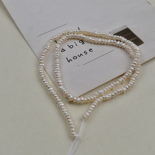1231 Natural freshwater pearls 3-4mm flat beads
