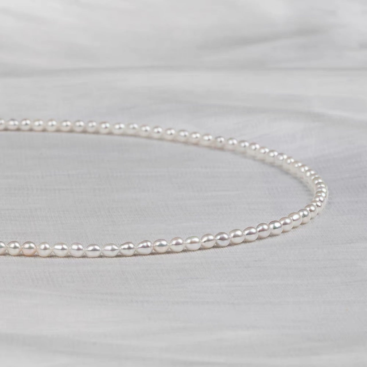 Natural freshwater strong light nearly round rice beads double-layer pearl necklace multi-stacked wear autumn and winter long sweater chain