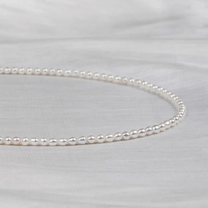 Natural freshwater strong light nearly round rice beads double-layer pearl necklace multi-stacked wear autumn and winter long sweater chain