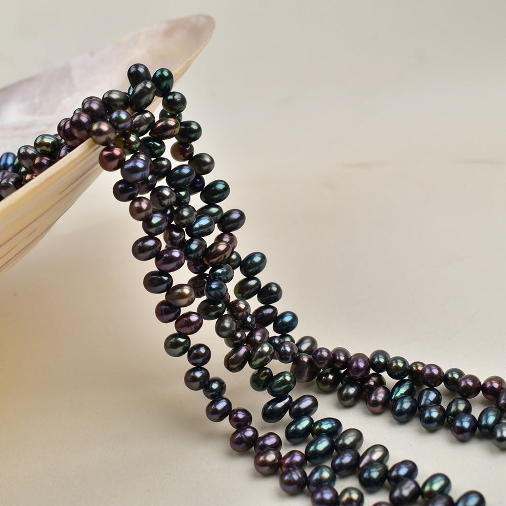 1047 Natural Freshwater Pearl 4-5mm Peacock Black Rice Bead