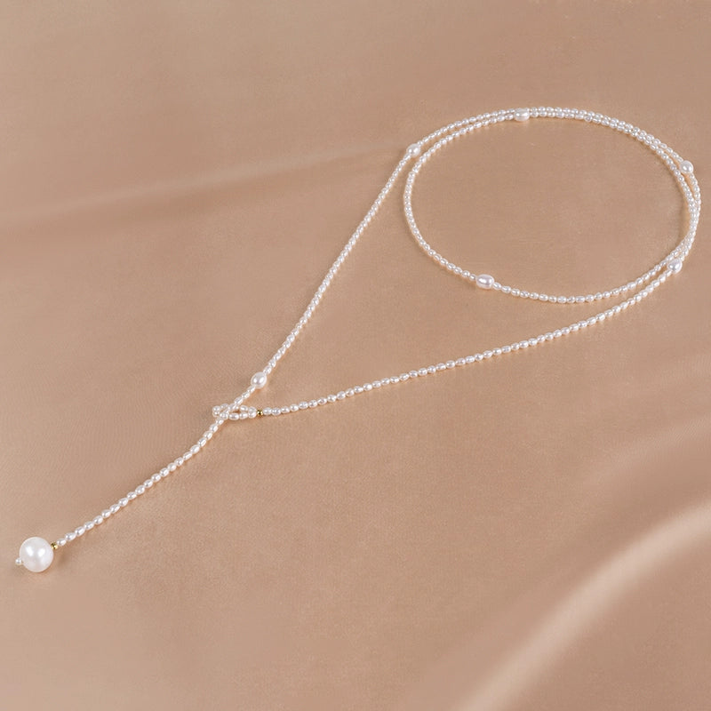 Natural freshwater pearl necklace, rice-shaped bead sweater chain, long temperament ins women's niche light luxury XL022