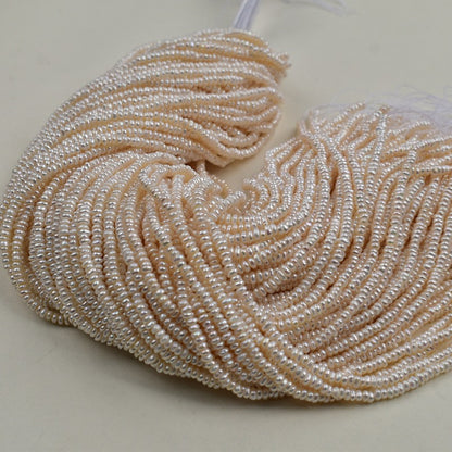 1231 Natural freshwater pearls 3-4mm flat beads