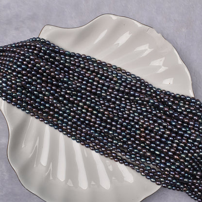 1043 4-5mm Natural Seedless Freshwater Pearl Black Millet-shaped Loose Bead
