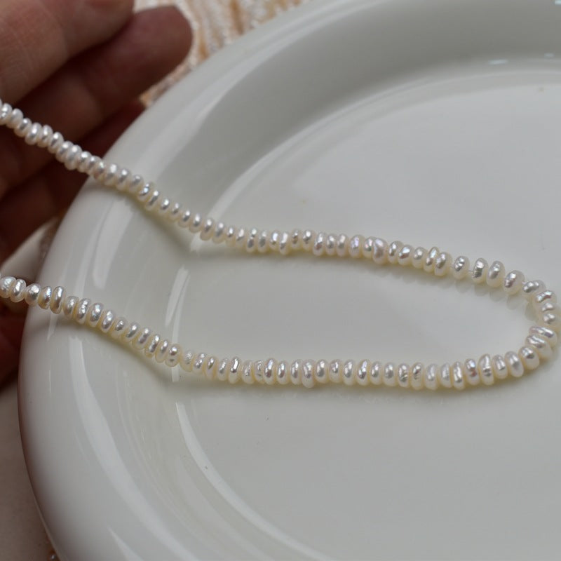 1231 Natural freshwater pearls 3-4mm flat beads