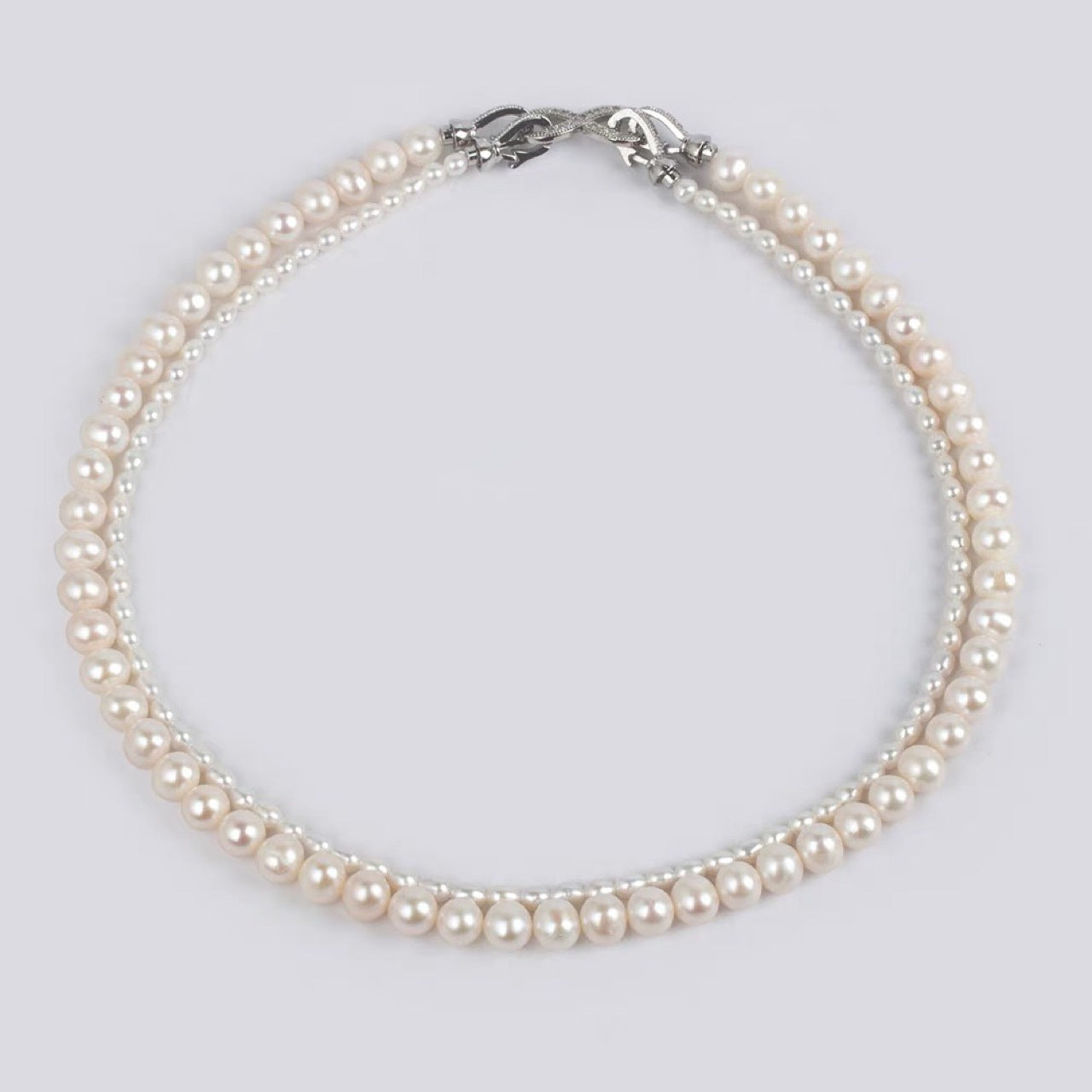 Natural freshwater strong light nearly round rice beads double-layer pearl necklace multi-stacked wear autumn and winter long sweater chain