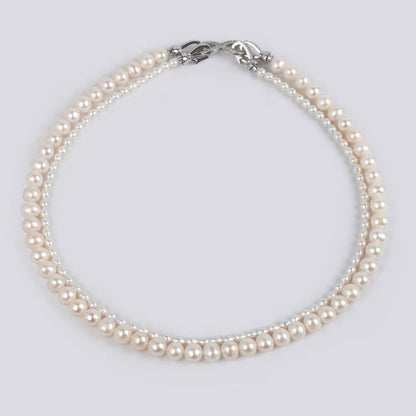 Natural freshwater strong light nearly round rice beads double-layer pearl necklace multi-stacked wear autumn and winter long sweater chain