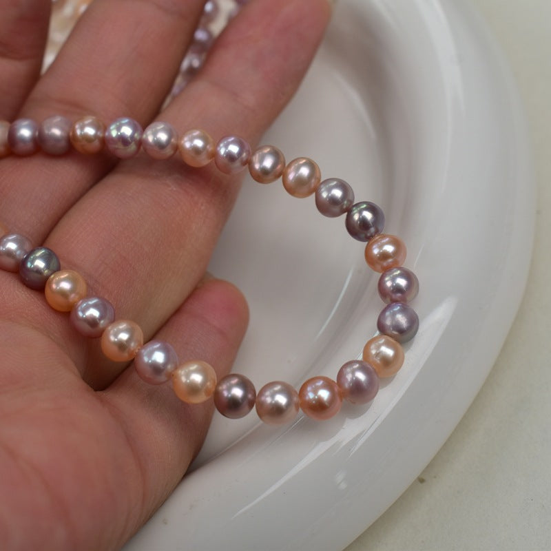 1178 5-6Mm nearly round pink purple pearl work in progress