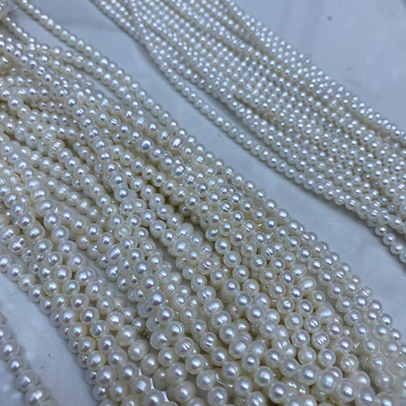 1173 Natural Freshwater Pearl 4-5-6 mm Threaded Near Round Pearl