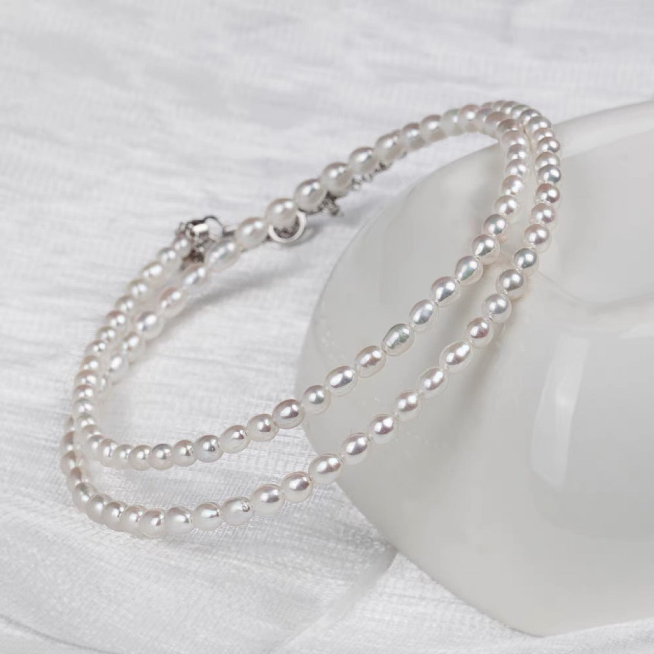 Natural freshwater strong light nearly round rice beads double-layer pearl necklace multi-stacked wear autumn and winter long sweater chain