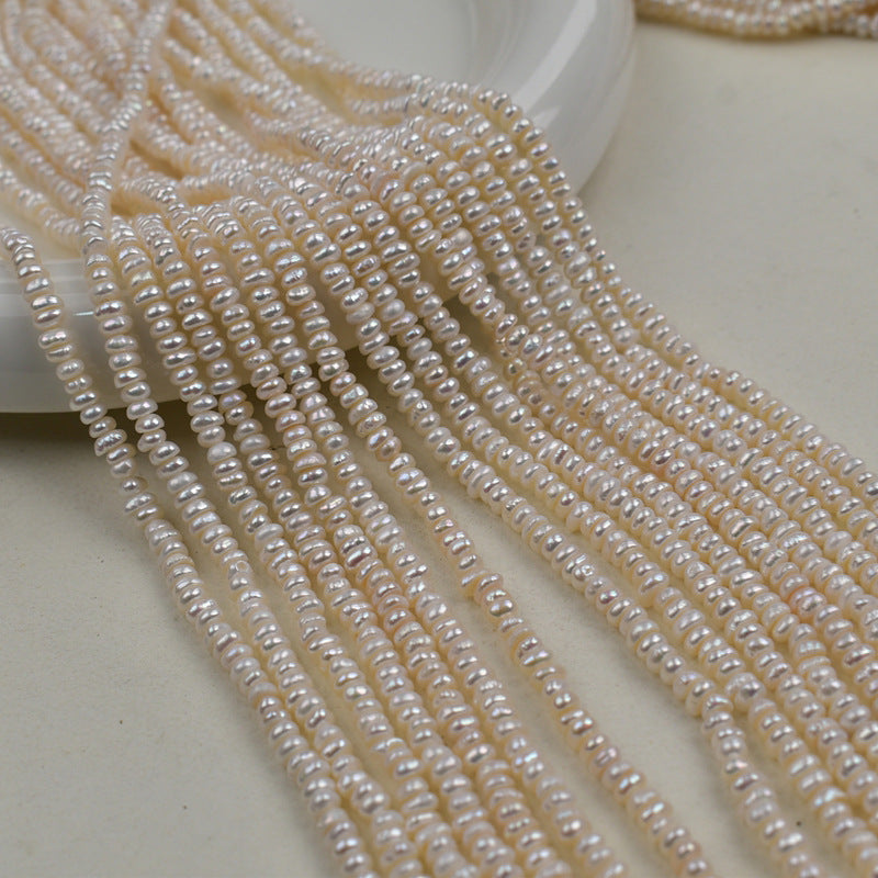 1231 Natural freshwater pearls 3-4mm flat beads
