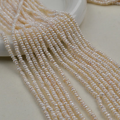 1231 Natural freshwater pearls 3-4mm flat beads