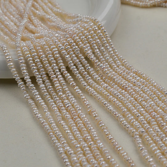 1231 Natural freshwater pearls 3-4mm flat beads