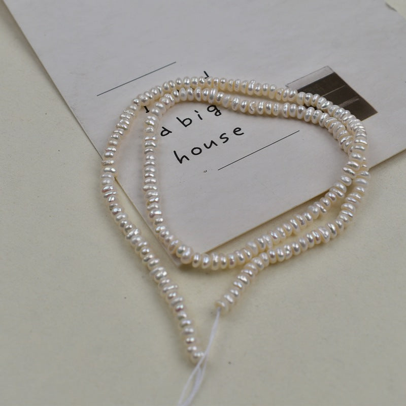 1231 Natural freshwater pearls 3-4mm flat beads