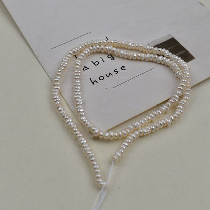 1231 Natural freshwater pearls 3-4mm flat beads