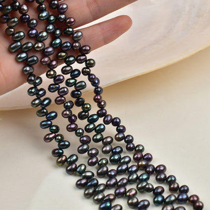 1047 Natural Freshwater Pearl 4-5mm Peacock Black Rice Bead
