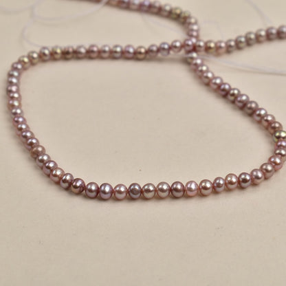1110  4-5Mm purple nearly round pearl