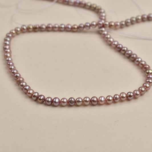 1110  4-5Mm purple nearly round pearl