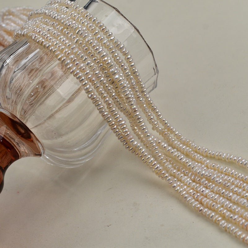 1231 Natural freshwater pearls 3-4mm flat beads