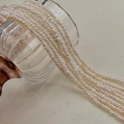 1231 Natural freshwater pearls 3-4mm flat beads